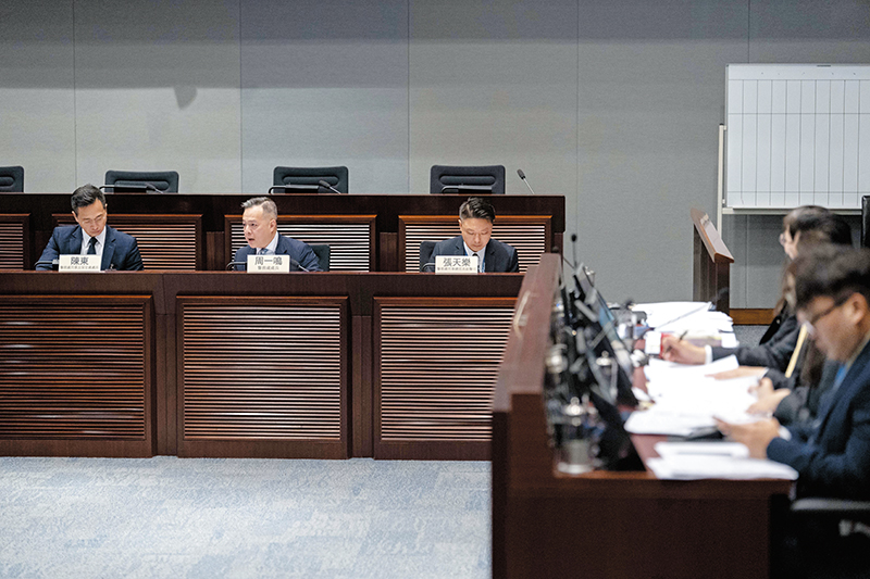The Commissioner (second left) attends the Panel on Security to brief Legislative Council Members on the law and order situation in 2025.